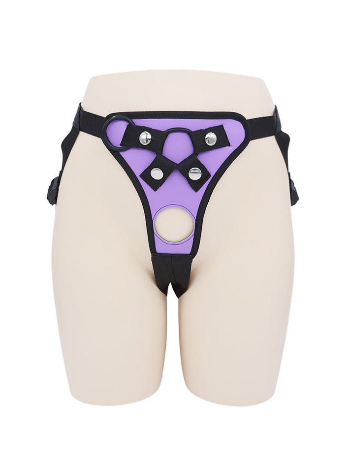 Front view of Purple faux leather strap-on harness with round front opening and metal hardware.