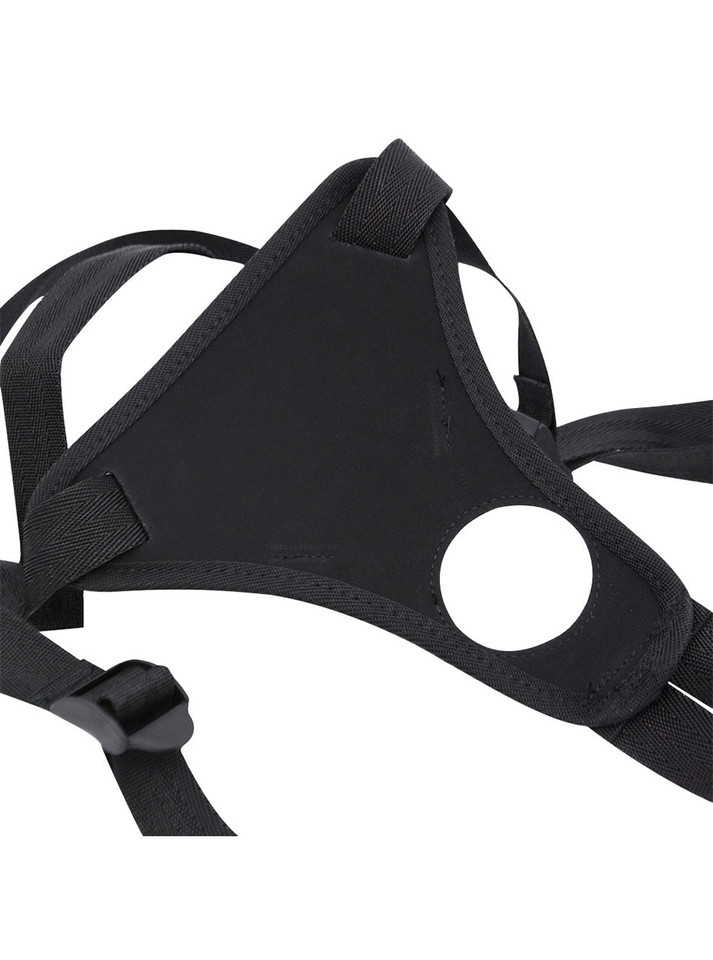 Close-up of the back side of the strap-on harness showing soft backing and stitched front opening.