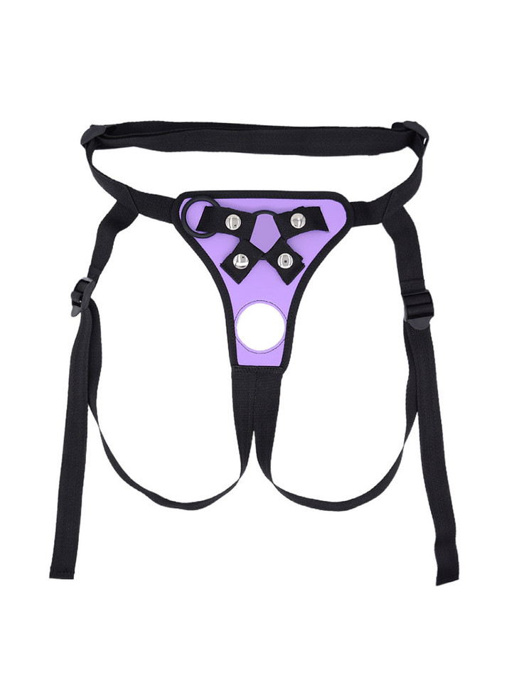 Flat lay of Purple faux leather strap-on harness with front opening, strap details and black trim.