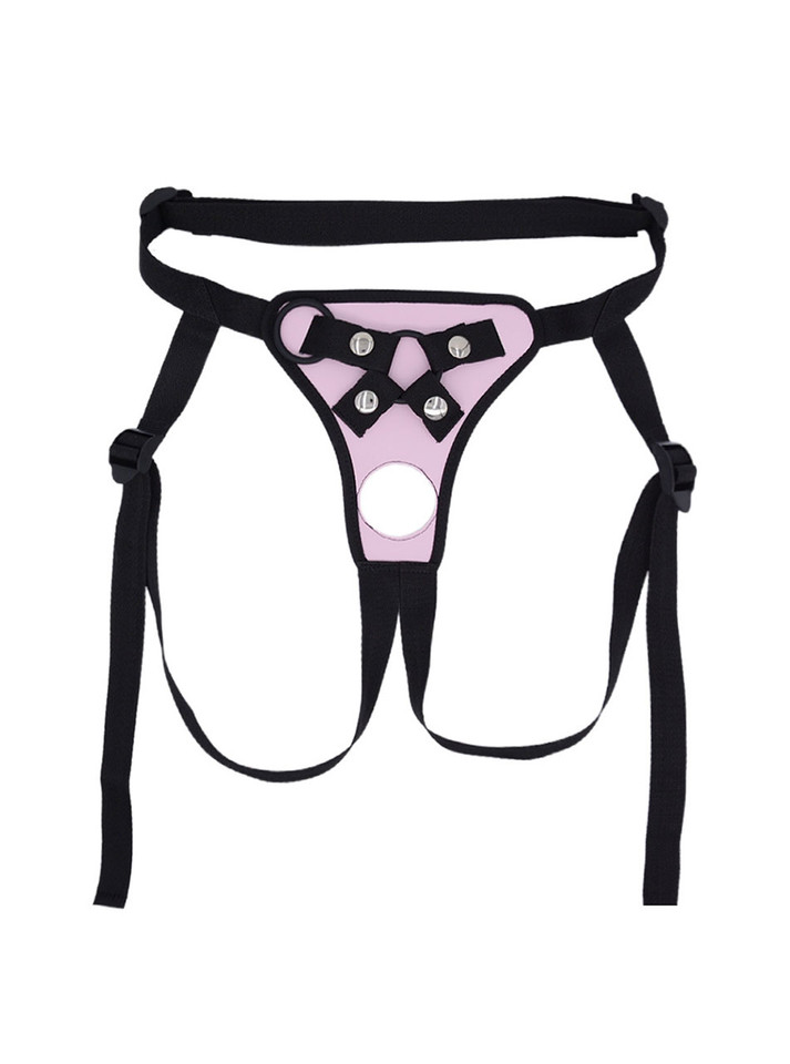 Flat lay of Pink faux leather strap-on harness with front opening, strap details and black trim.