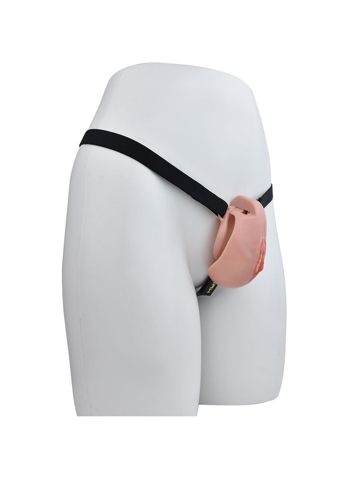 nude resin vagina chastity cage with black belt shown on mannequin angled side view