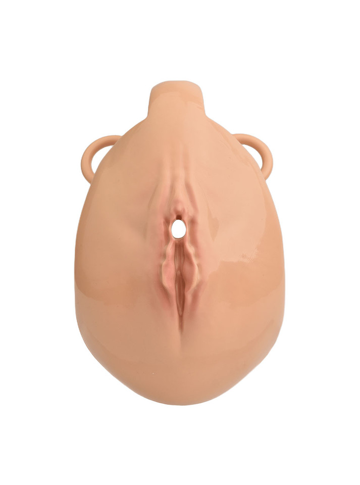 tan resin vagina chastity cage front view with realistic sculpted detail