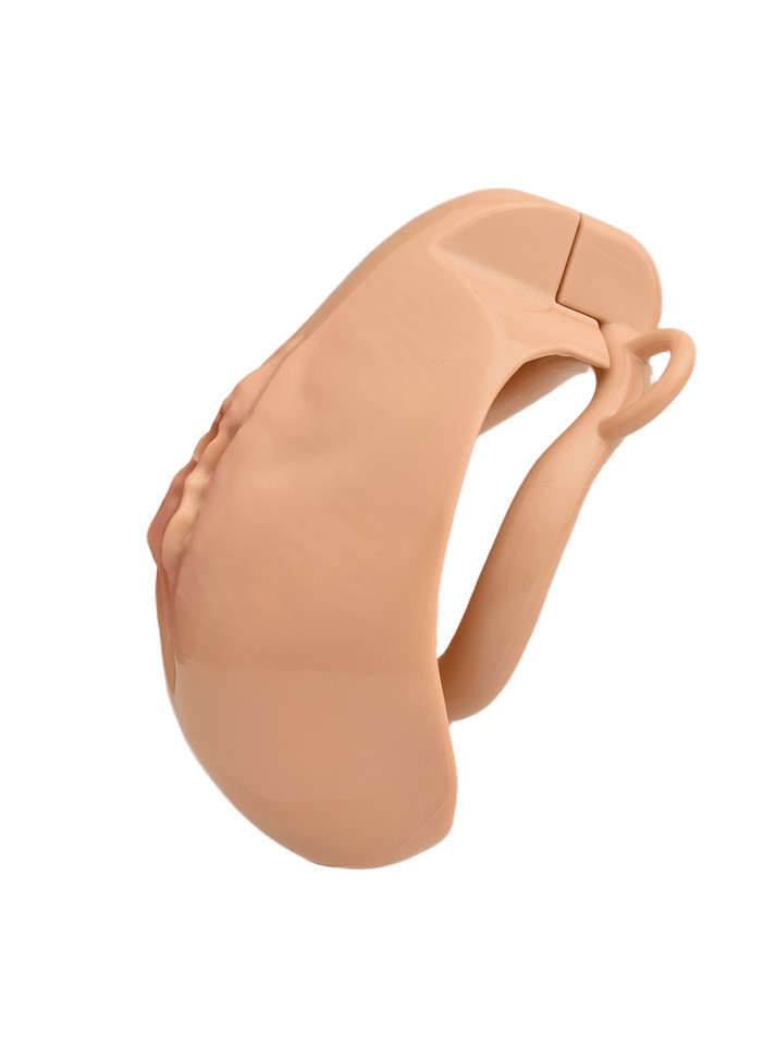 tan resin vagina chastity cage angled side view showing curved cage shape