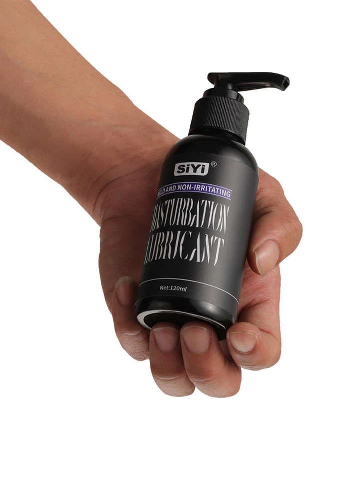 Silicone-based masturbation lubricant 120 mL (4.1 fl oz) bottle held in hand