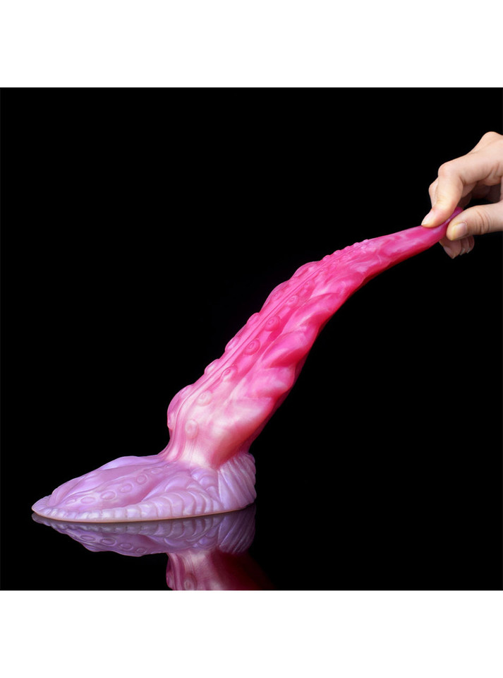 Pink silicone tentacle dildo being pulled by the tip to demonstrate its flexible construction