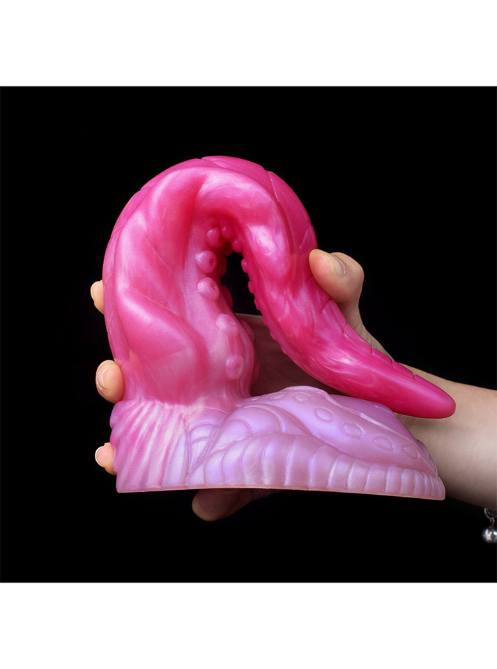 Large fantasy tentacle dildo folded into a deep curve to show flexibility