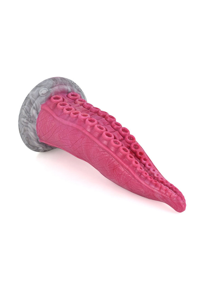 Pink tentacle dildo lying on its side showing rows of suckers and curved tapered shape