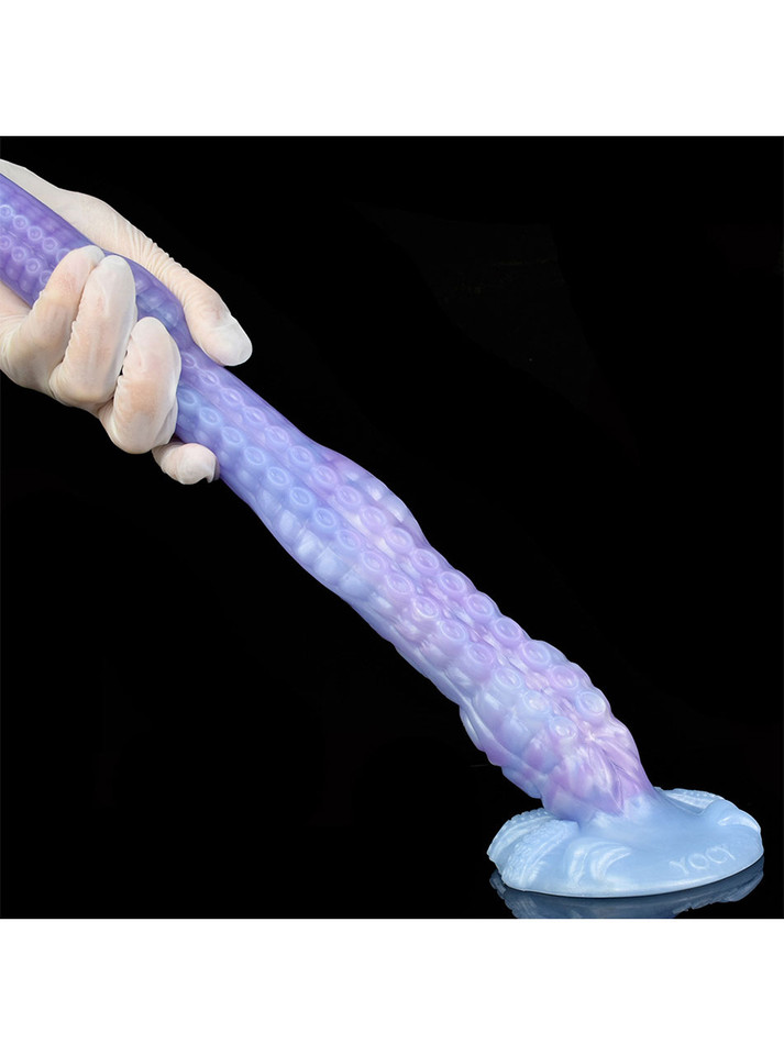 Flexible purple Kraken tentacle dildo stretched outward from its suction cup base