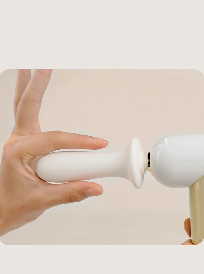Detachable silicone insert being removed from 2-in-1 automatic thrusting sex toy
