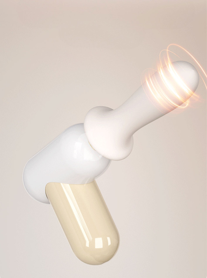 Compact automatic thrusting sex toy with white silicone insert and cream massage handle