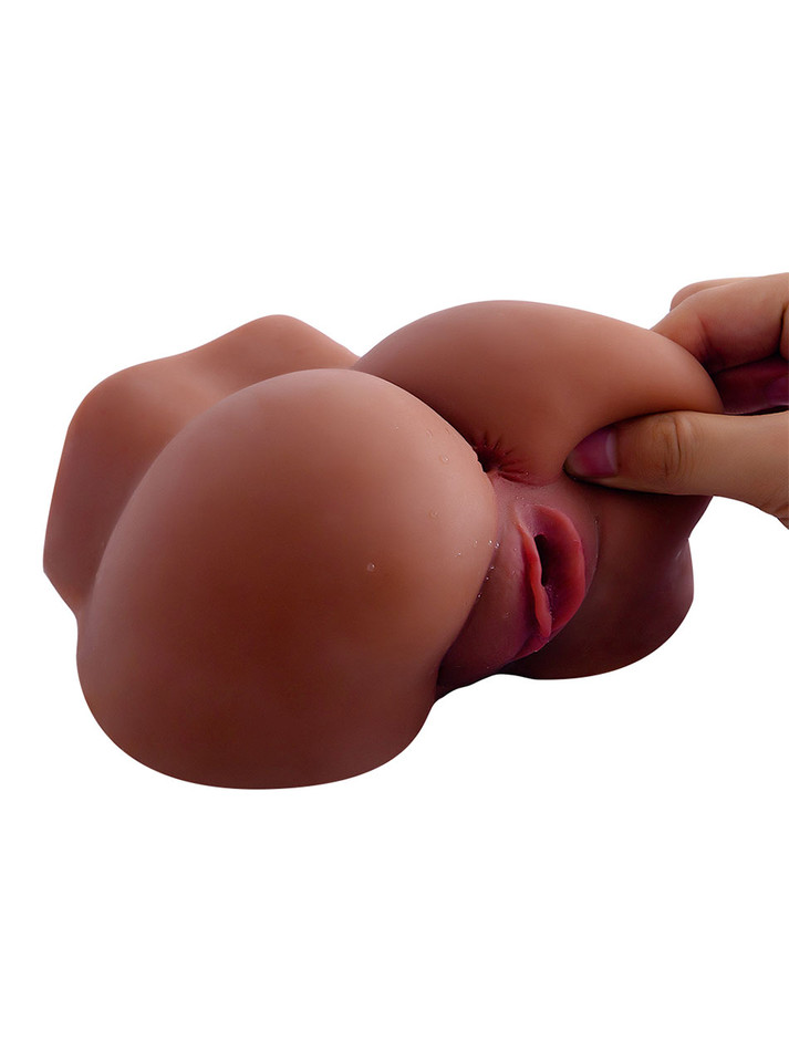 Soft cheek of the deep brown TPE ass and pussy masturbator being squeezed by hand