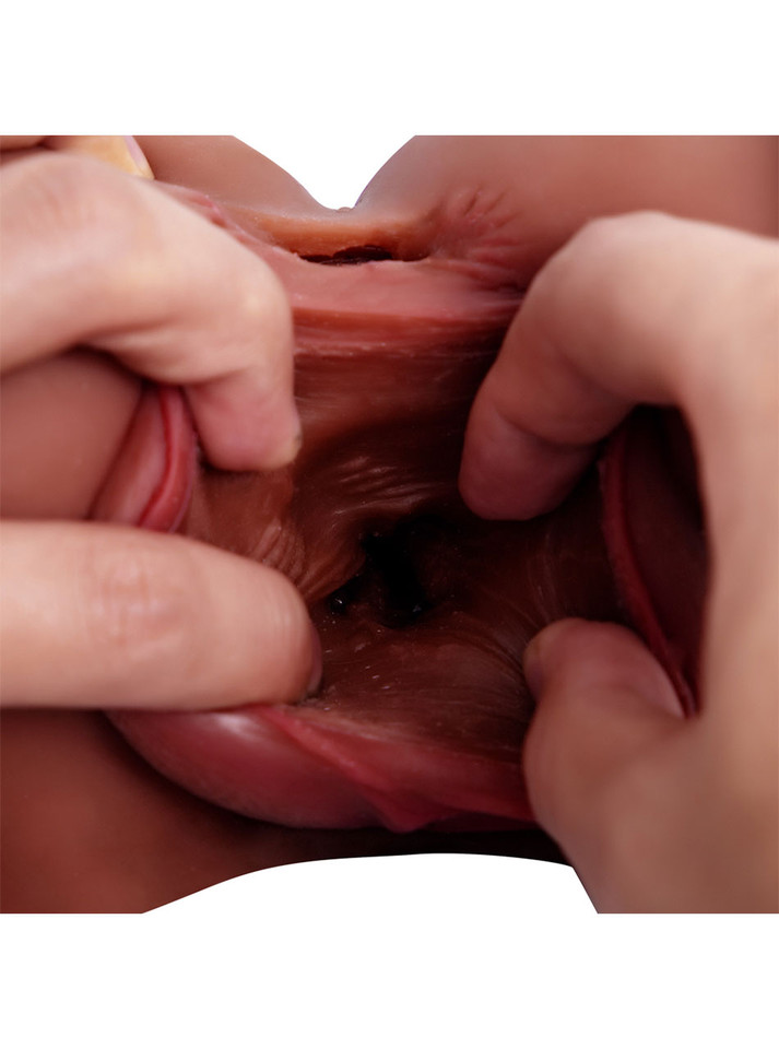 Close-up of the textured vaginal canal inside the deep brown realistic masturbator