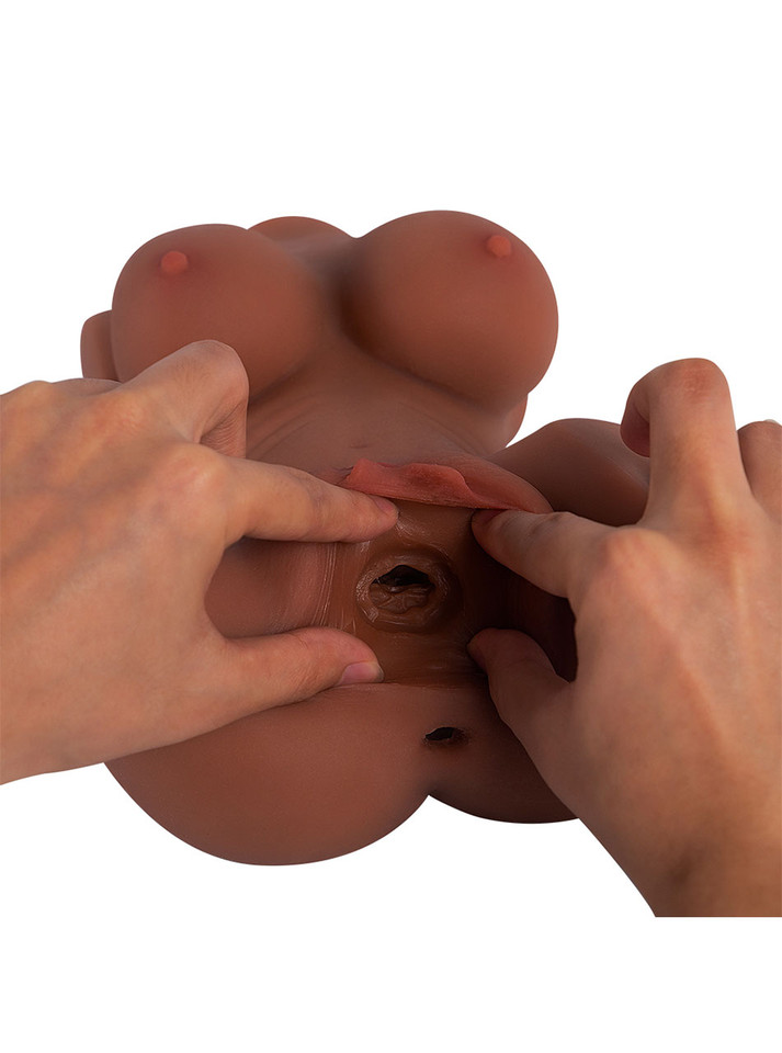 Close-up of the layered texture inside Nia's vaginal hole with her anal entrance visible below
