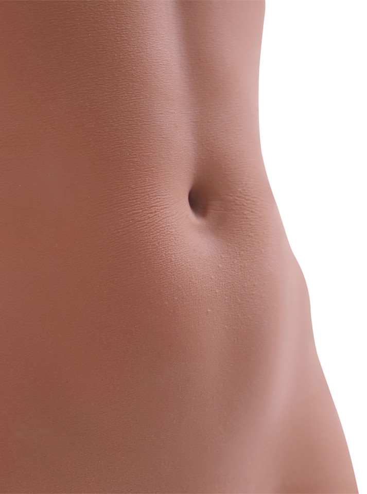 Close-up of Mercedes brown skin torso sex doll’s waist and navel
