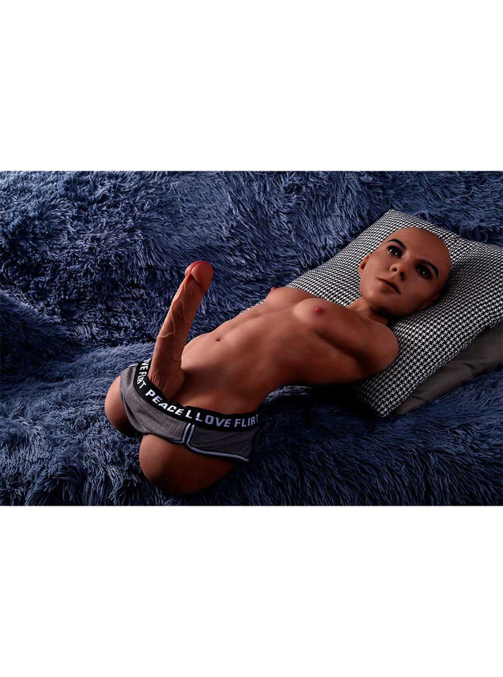 Tyson brown male sex doll reclining on a pillow wearing black underwear