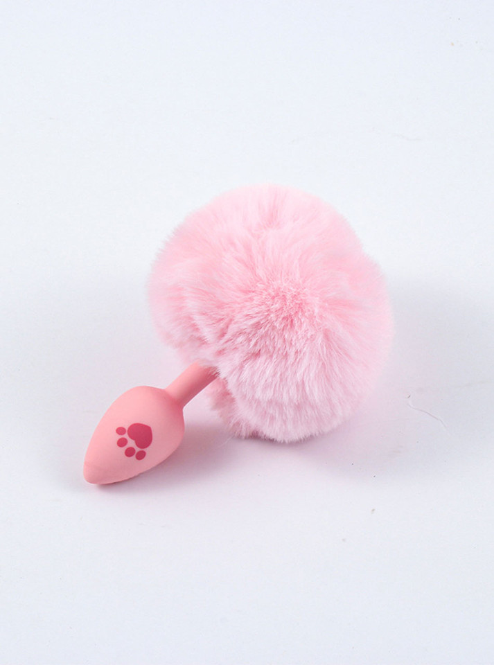Baby pink silicone bunny tail butt plug with a cute paw print, designed for a gentle and playful ageplay experience.