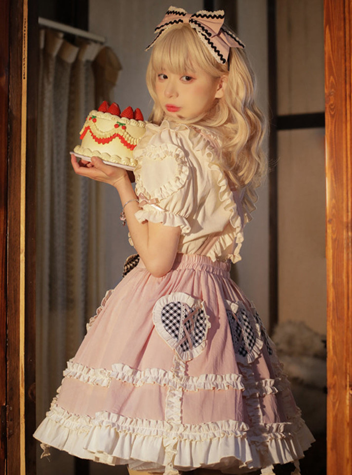Adorable pink princess dress in soft cotton, lavishly decorated with lace and bows, offering a sweet and playful vibe.