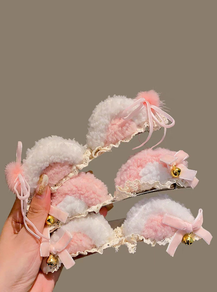Adorable kitty ear headband with jingling bells, combining baby pink and white for a cute ageplay accessory.