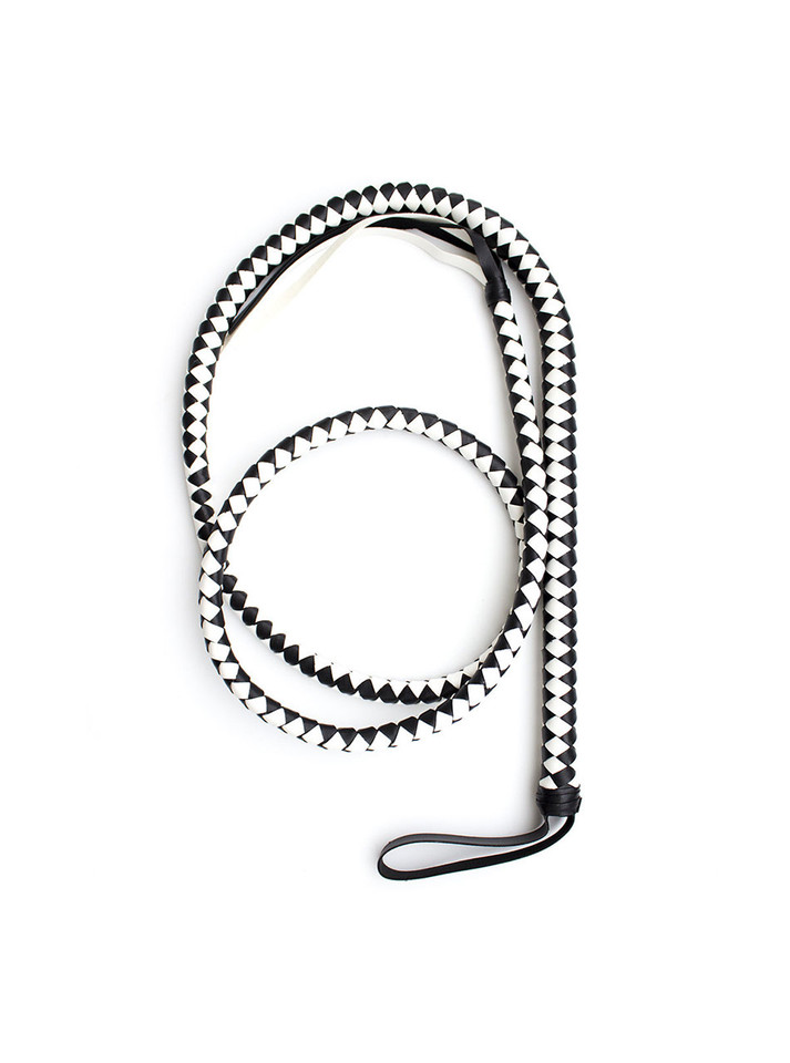 Premium hand-braided black and white leather whip for precision impact in discipline play.