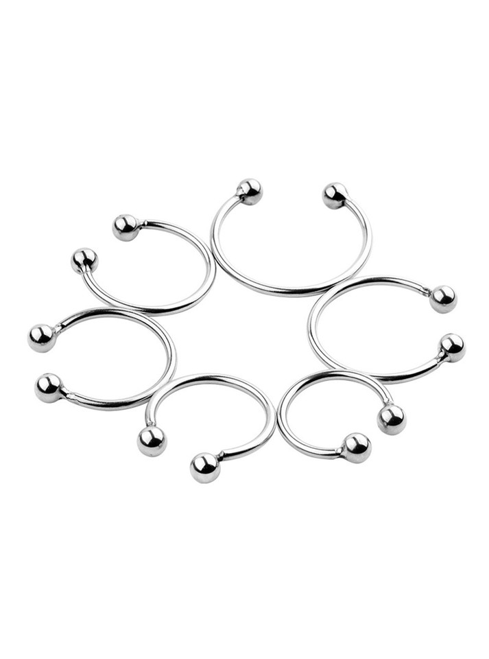 Multiple stainless steel pleasure rings showcasing various sizes for a custom fit