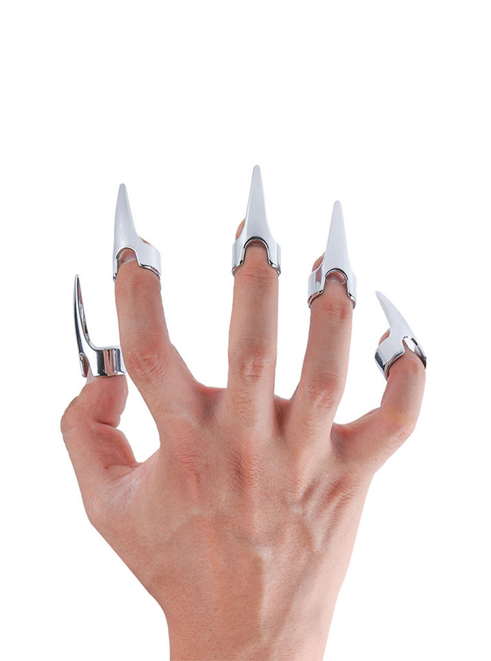 Elegant stainless steel play ring on a commanding hand, reflecting sophistication and control.