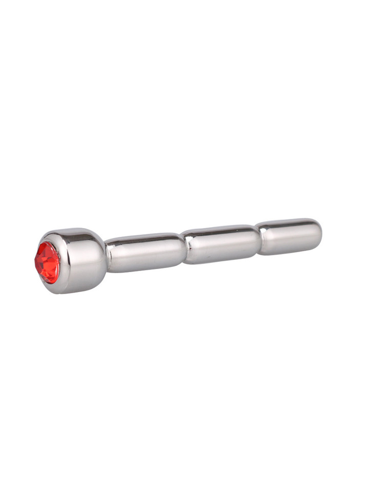 Luxurious stainless steel penis plug with a gleaming red jewel end, combining elegance with ecstasy.
