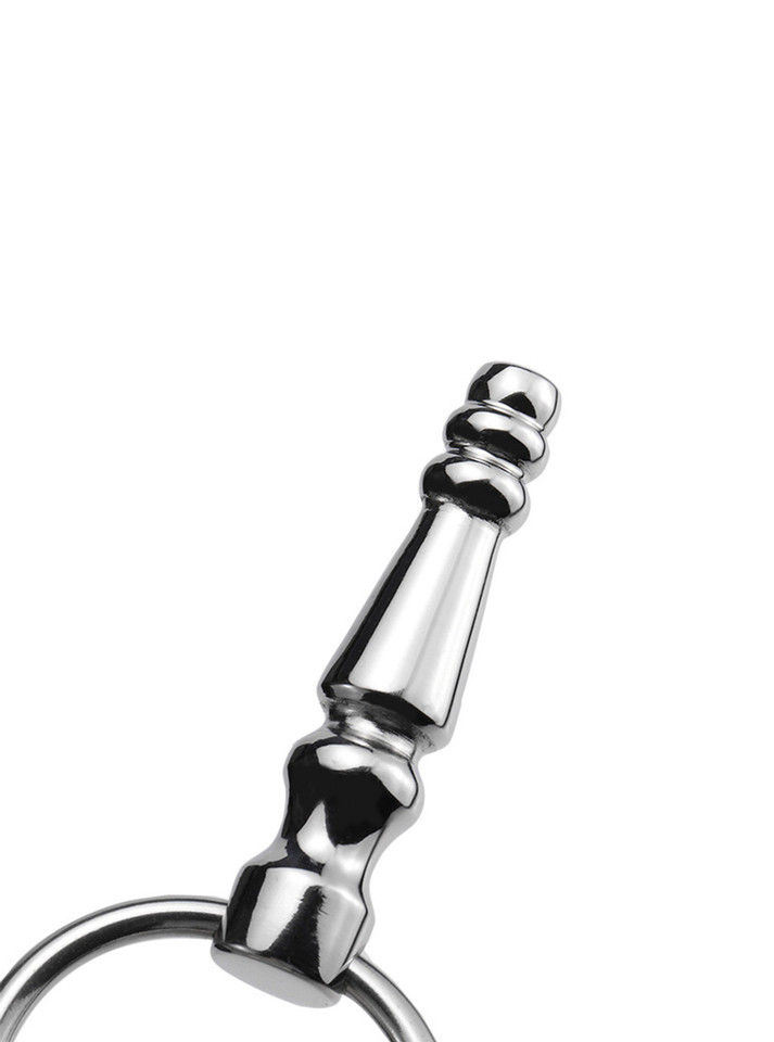 Close-up of a stainless steel penis plug, highlighting its reflective beauty and craftsmanship.