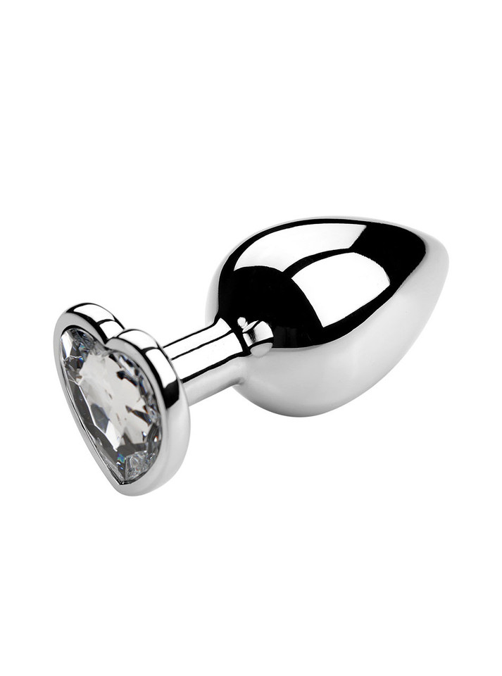 White heart jewel metal butt plug on a reflective surface, ideal for enhancing anal play.