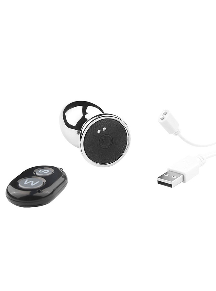 Apex Vibrating Aluminum Alloy Butt Plug with a sleek, polished finish, streamlined design, and flared base, accompanied by a remote control for wireless operation and quiet vibrations.