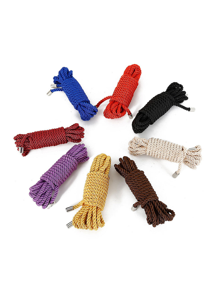 A selection of colorful Shibari Silk Polyester Bondage Ropes, neatly coiled and ready for use.