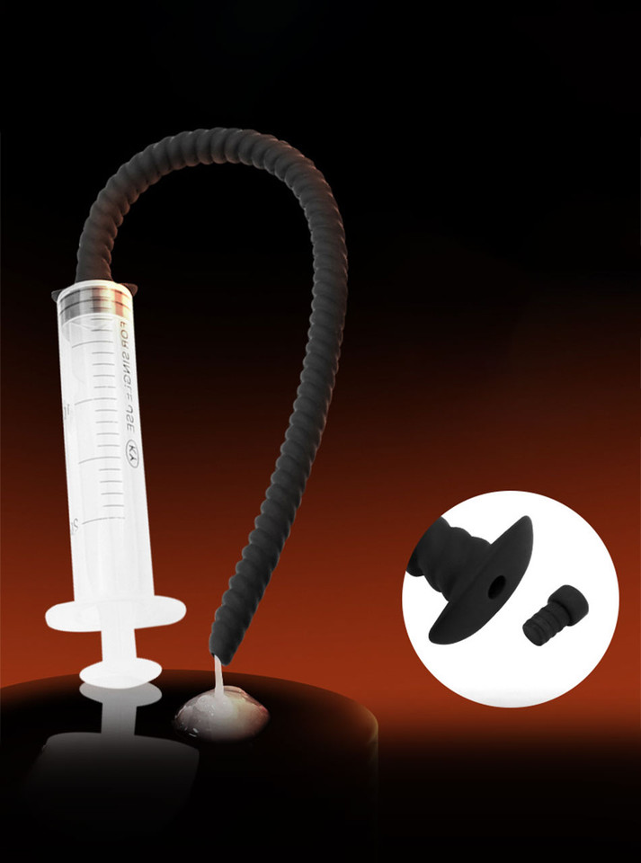 Hollow urethral sound attached to syringe, ready for use.