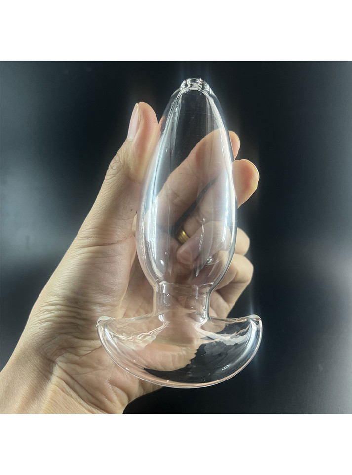 Hand holding the Clear Glass Hollow Anal Gaper, demonstrating its transparent and ergonomic features.