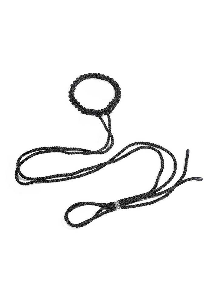 Close-up of the black rope collar with intricate knotting design