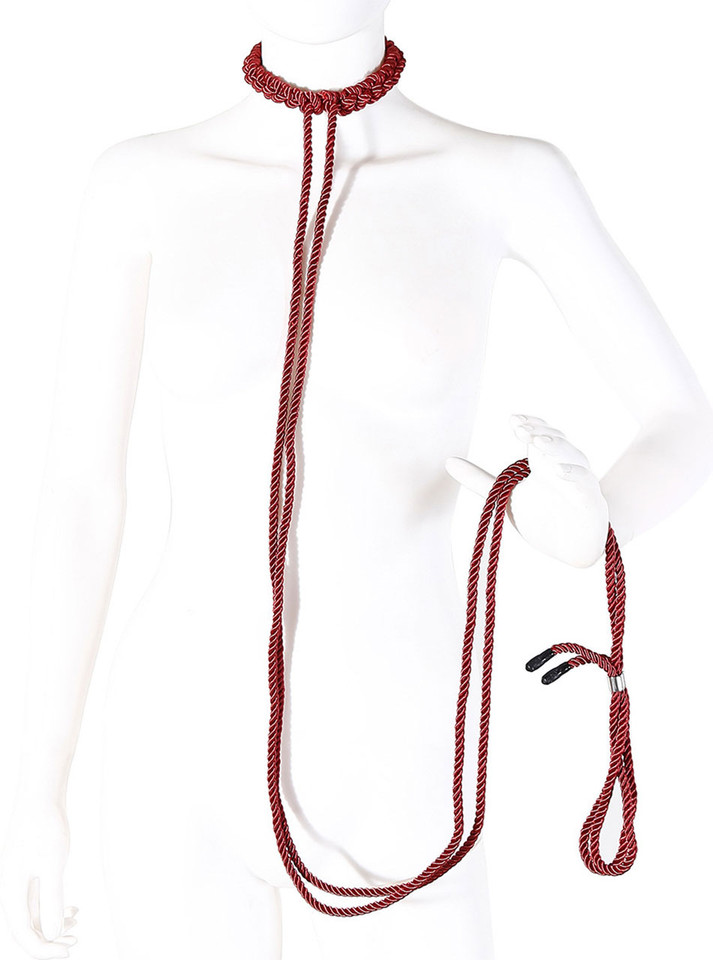Mannequin displaying the red rope collar and leash set wrapped around hand