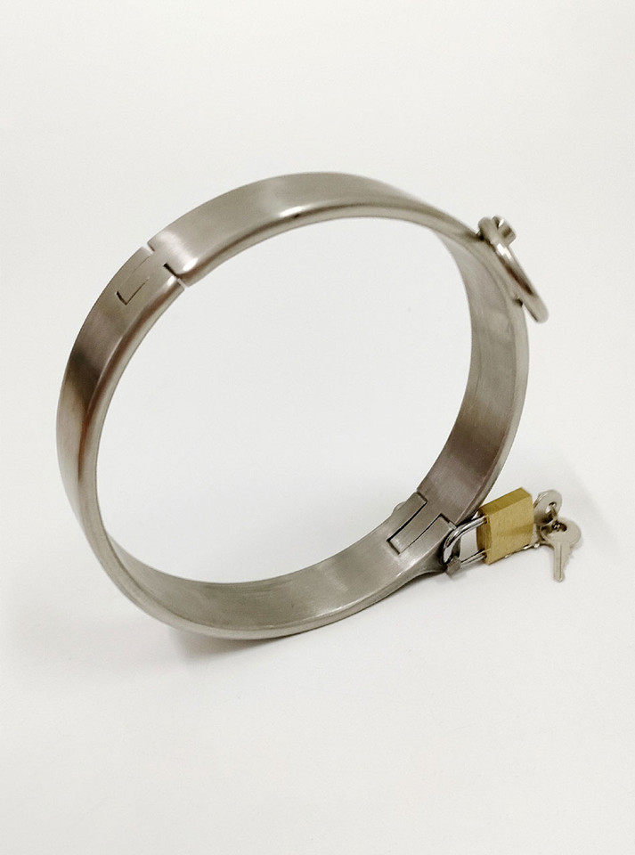 Heavy duty slave collar locked and ready for BDSM play.