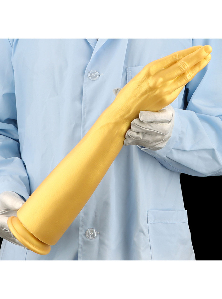 Side view of the golden forearm dildo, showcasing its thick forearm and realistic fist.