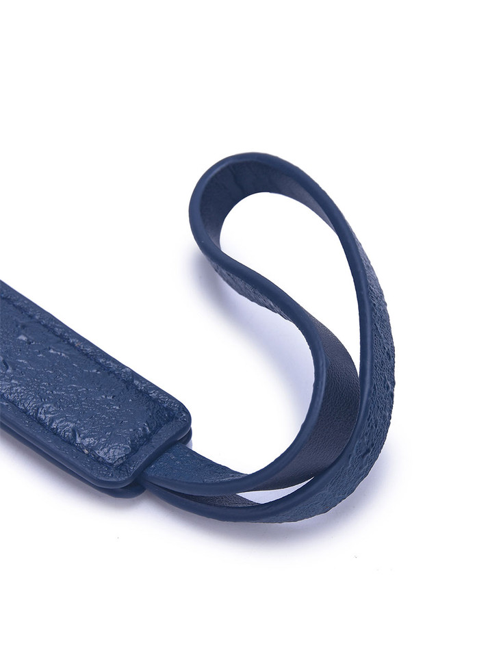 Navy leather paddle handle with wrist loop for secure handling.