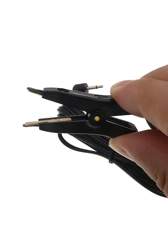 Close-up of black conductive nipple clamps for e-stim play.