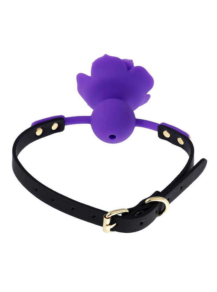 Close-up of a purple silicone rose gag with a black adjustable strap.