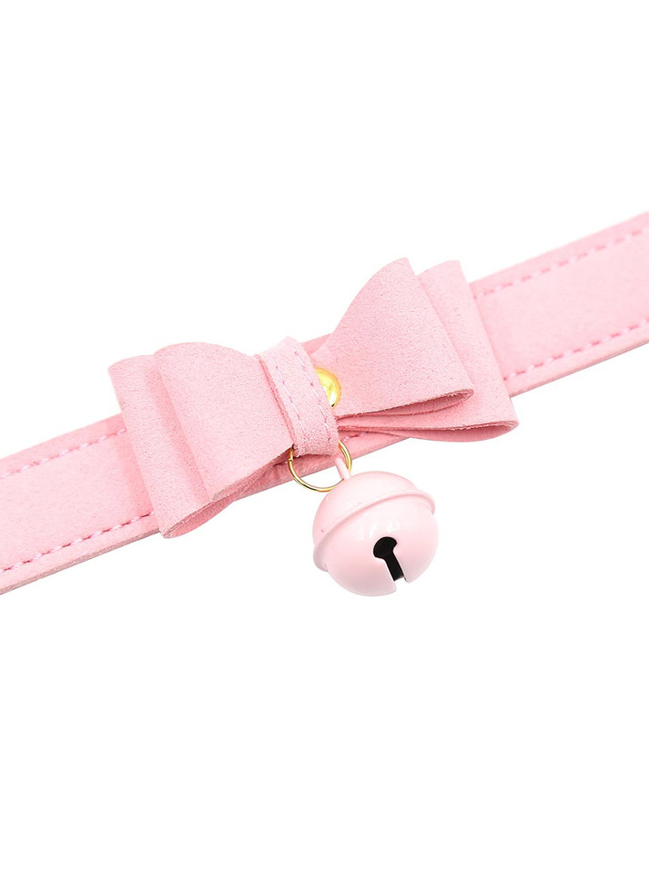 A close-up of the bell and bow detailing for a delicate, playful touch.