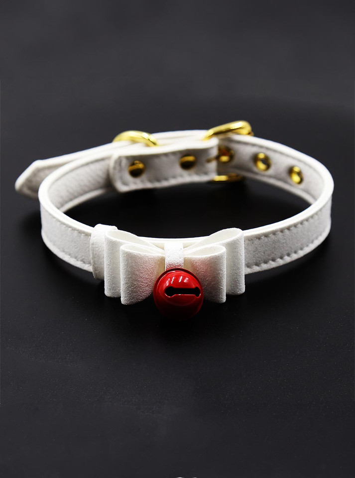 A white faux leather choker collar with a delicate bow and red jingling bell.