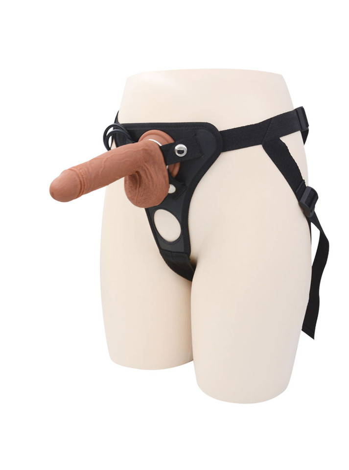 Front view of thick realistic strap-on dildo harness worn on mannequin