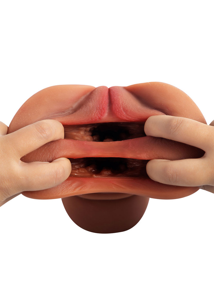 User stretching open both holes of dual-entry stroker