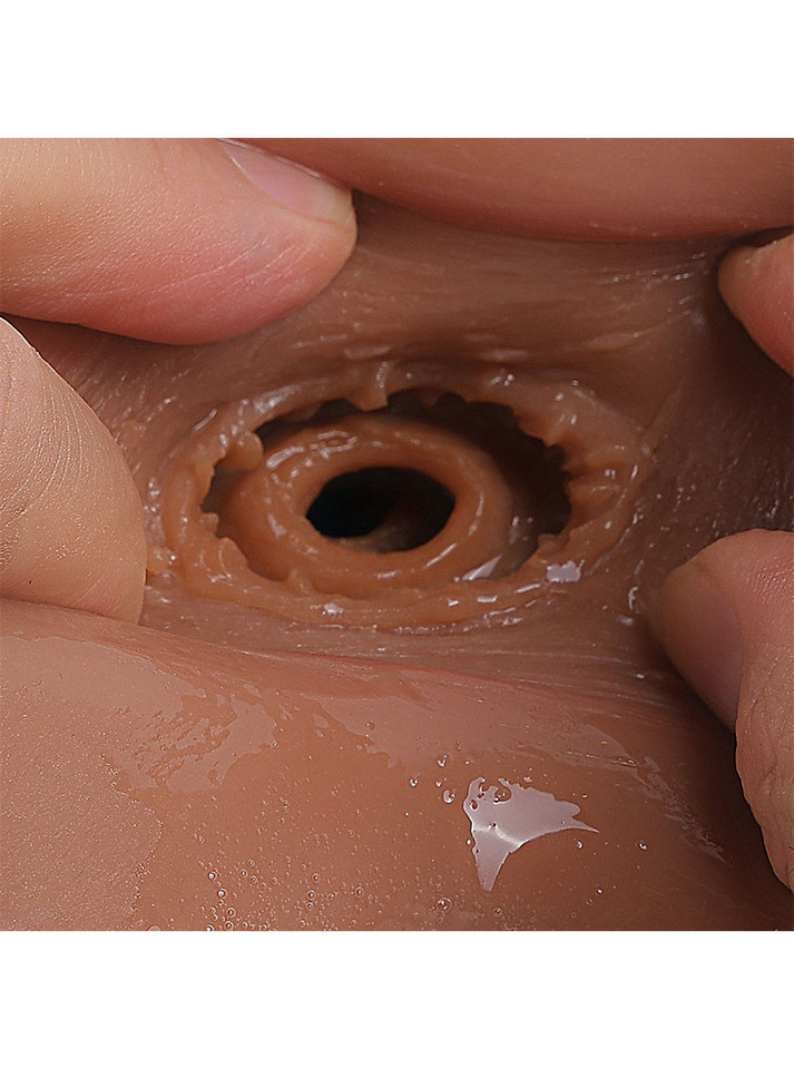 Close-up of anal canal texture in black TPE sex doll