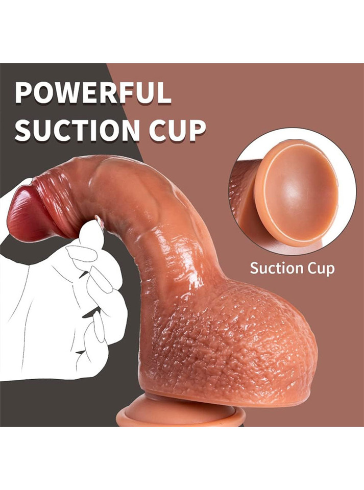 Powerful suction cup base securing realistic dildo on flat surface.
