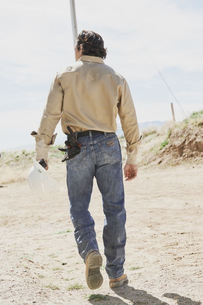 Worker walking away in FR jeans