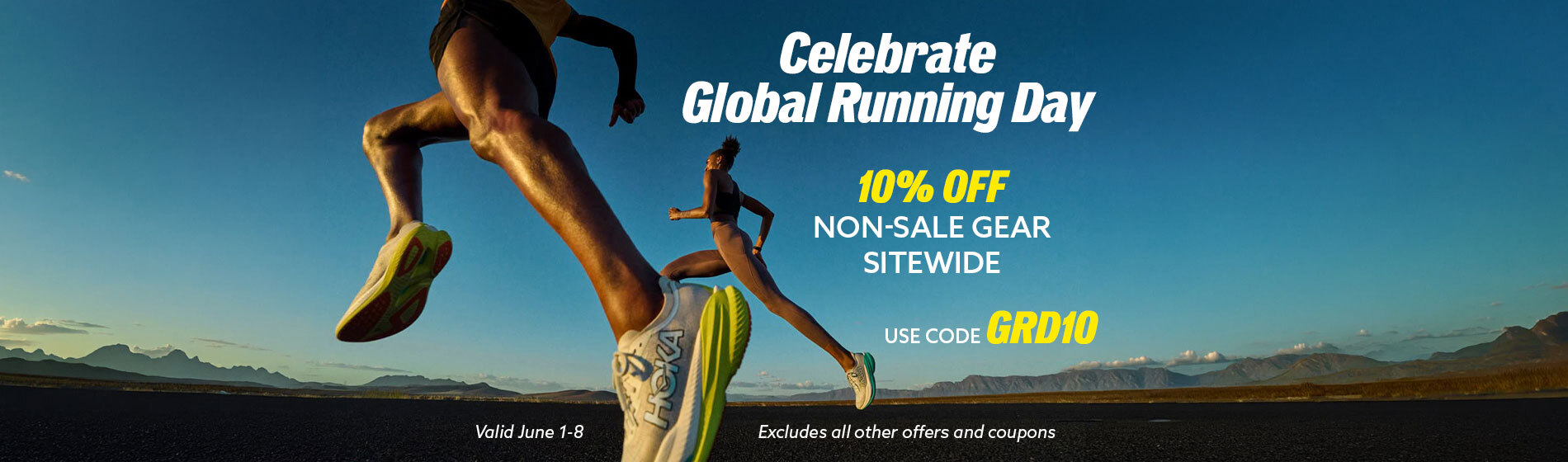 Graphic, two runners mid‑stride on open road with mountains and clear sky behind, text, Celebrate Global Running Day with 10% Off Non‑Sale Gear Sitewide – Use Code GRD10 June 1–8 