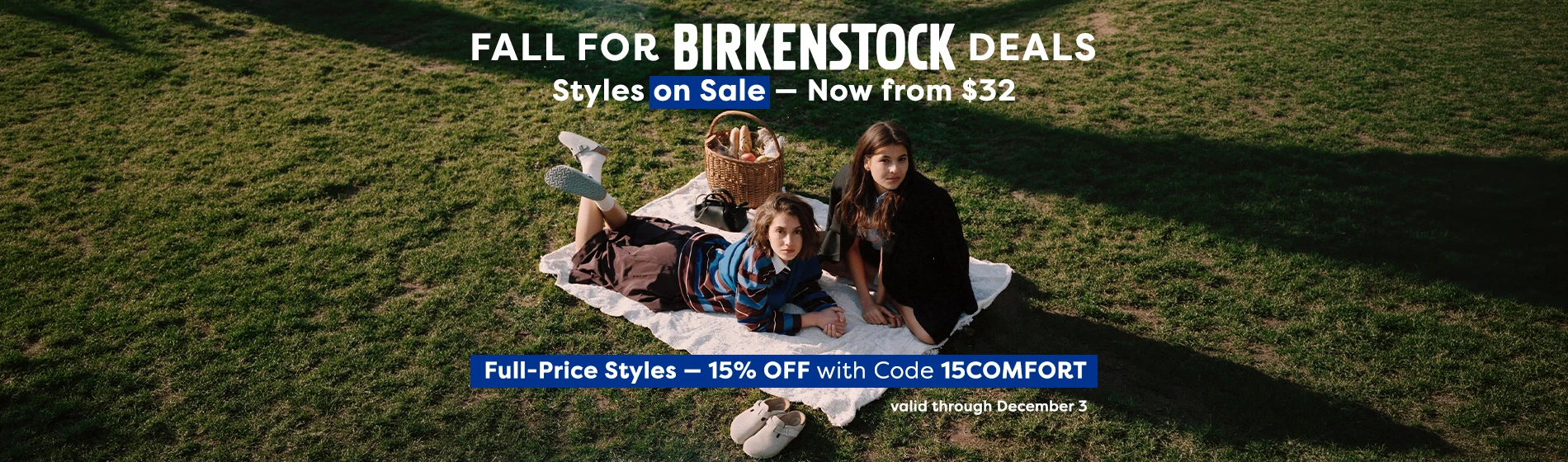 graphic, two women having a picnic on a white blanket on a large green lawn, one lying on her stomach with her legs raised wearing a striped sweater, white socks, and light blue Birkenstock clogs next to a wicker basket, with another pair of light-colored Birkenstock clogs resting on the grass below, text, FALL FOR BIRKENSTOCK DEALS: Styles on Sale from $32 + 15% OFF Full-Price Styles with Code 15COMFORT