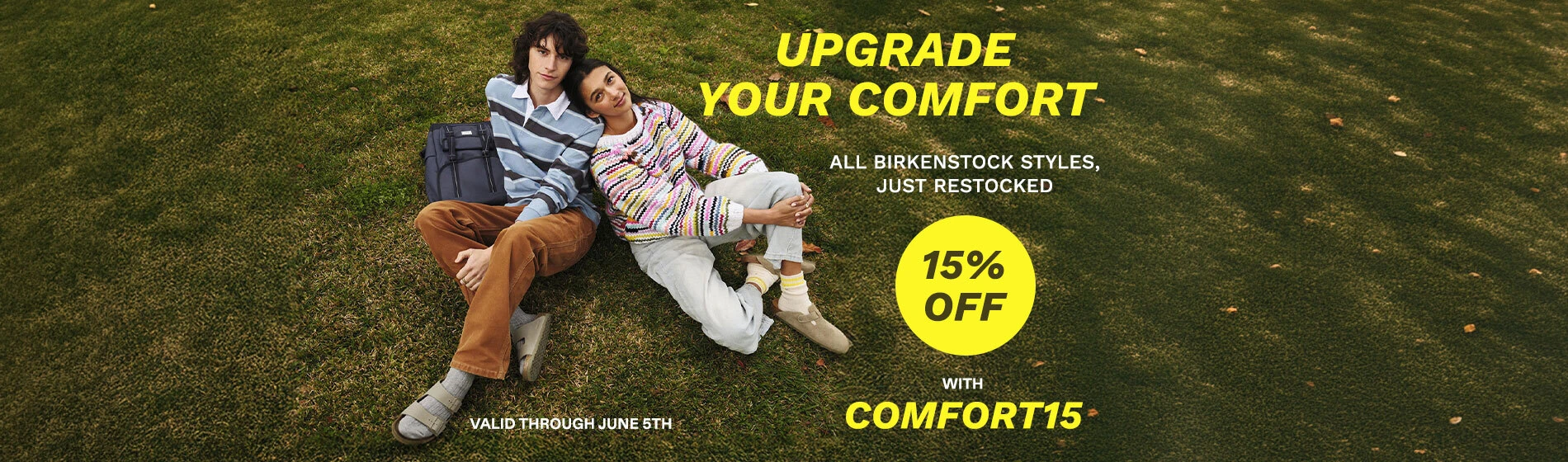 Graphic, close‑up of two people relaxing on grass in Birkenstock sandals, text, UPGRADE YOUR COMFORT: Save 15% OFF on BIRKENSTOCK Iconic Styles, Just Restocked - use code COMFORT15 at checkout