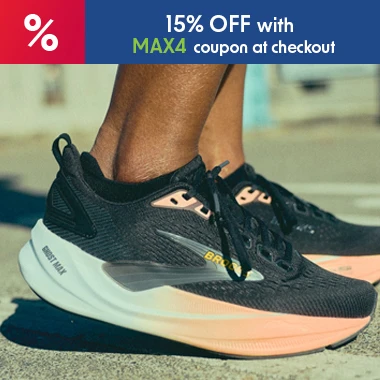 graphic, close-up of a person's feet standing on pavement wearing black Brooks running shoes with a peach-to-white gradient sole, text, Meet the all-new BROOKS Ghost Max 4 and enjoy a launch-only 15% discount with code MAX4 at checkout
